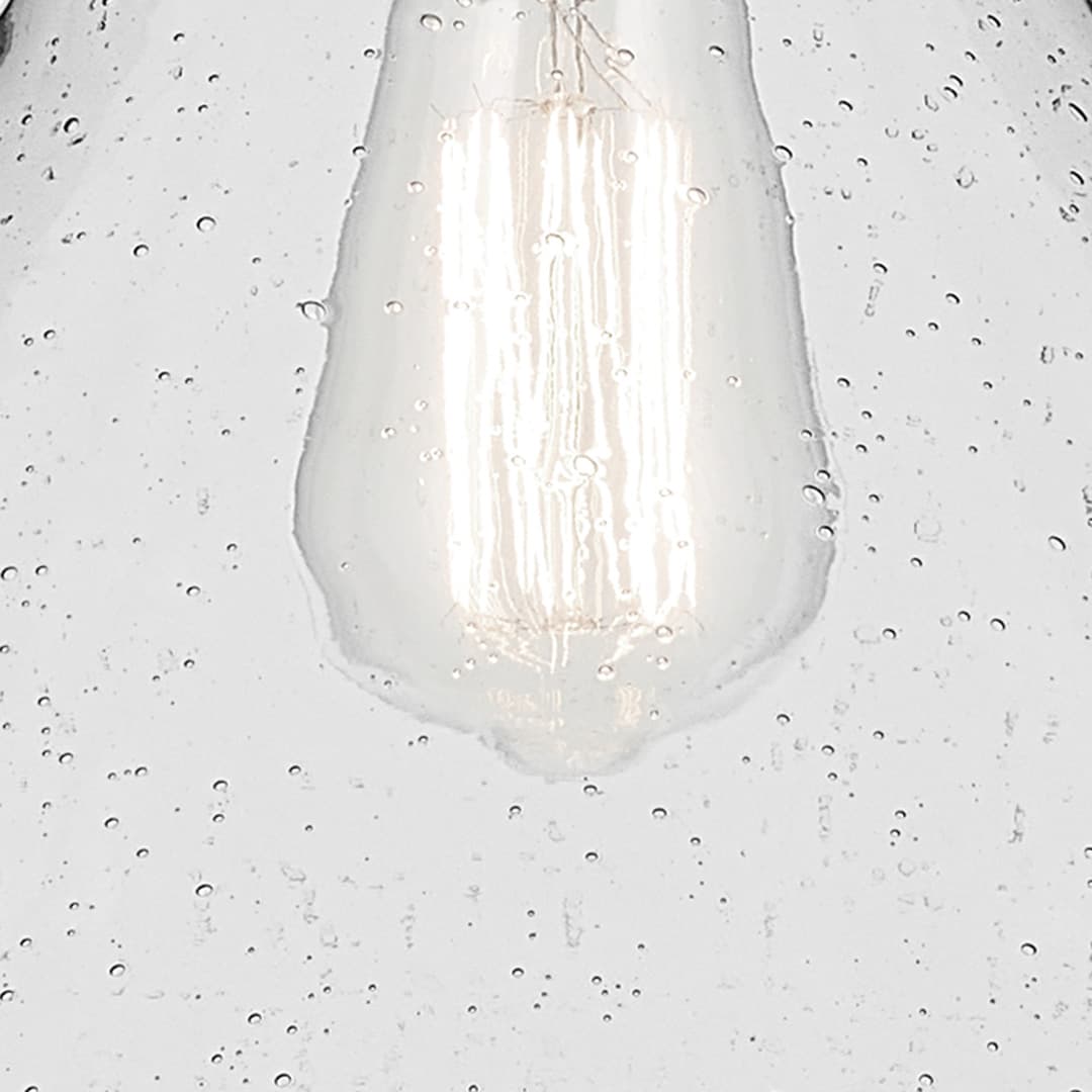 Close up view of the Avery 11.75" 1-Light Cone Pendant with Clear Seeded Glass in Nickel on a white background