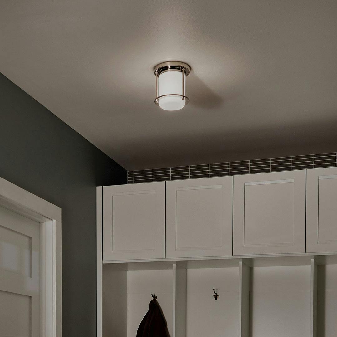 Night time mudroom with Brit 7.25 Inch 1 Light Flush Mount with Satin Etched Cased Opal Glass in Polished Nickel