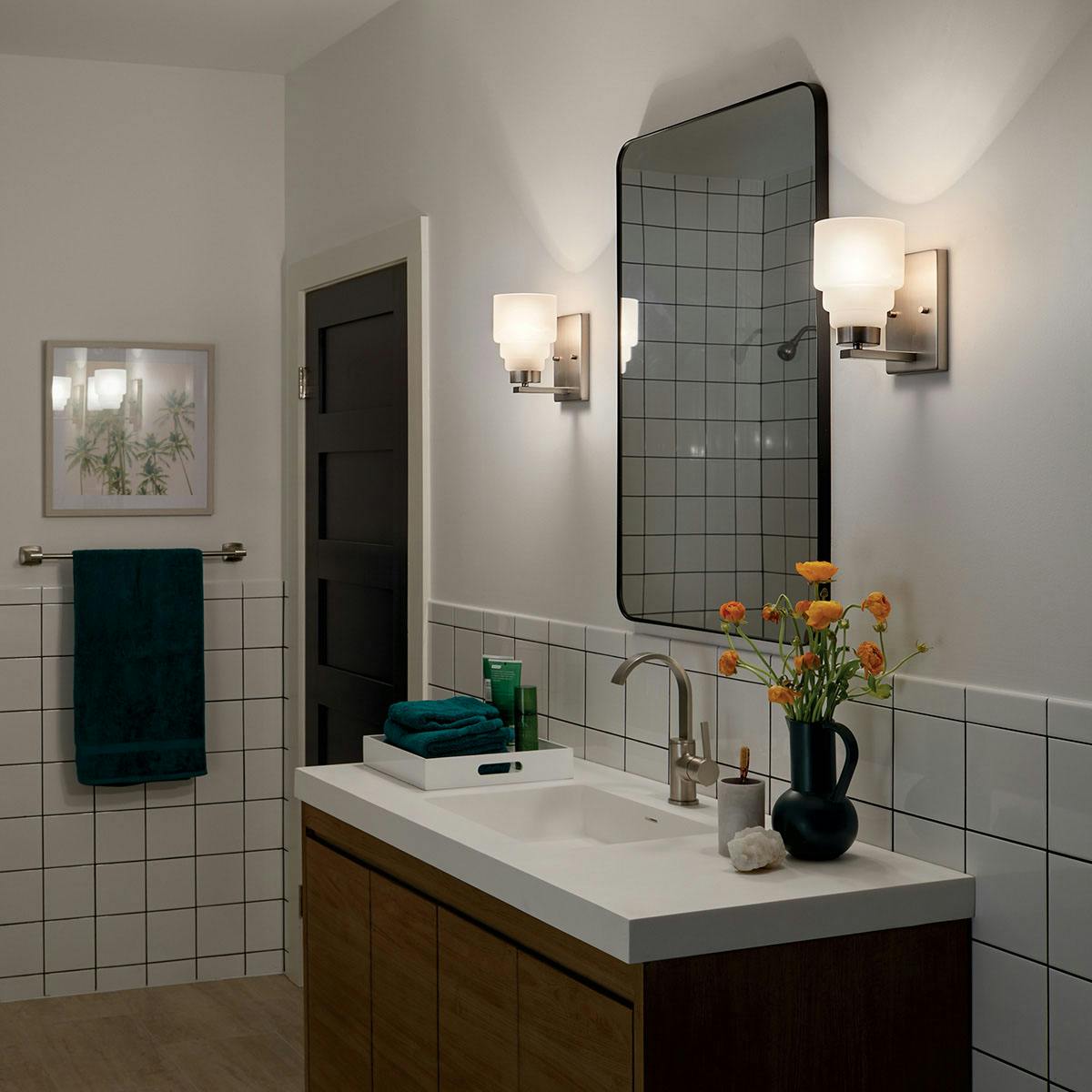 Nighttime Bathroom featuring Vionnet vanity light 55010NI