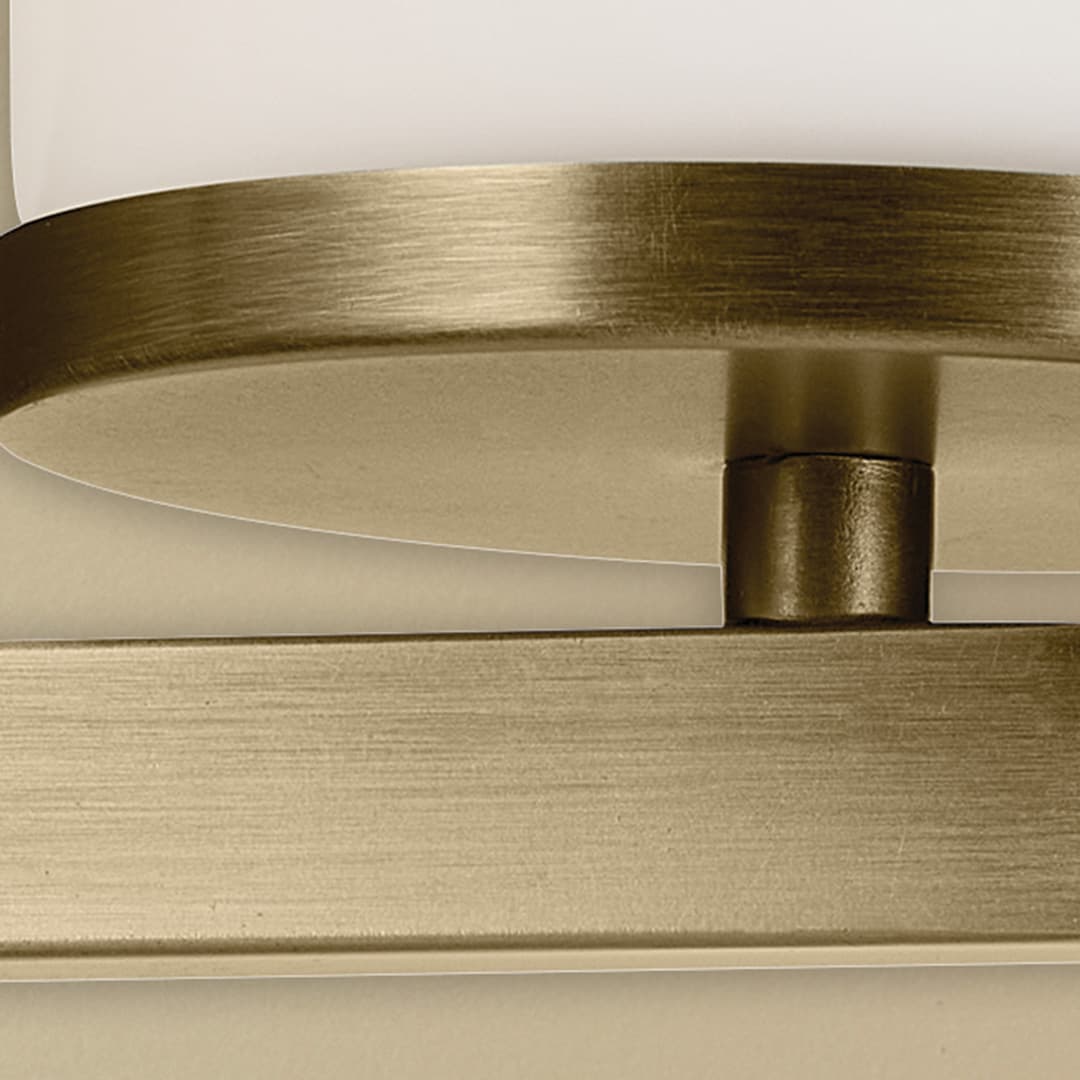 Close up of the Crosby 4.5" 1-Light Wall Sconce with Satin Etched Cased Opal Glass in Natural Brass