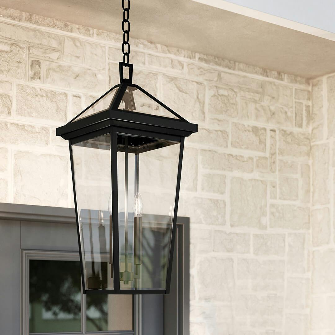 Profile view of the Regence 26" 2 Light Outdoor Pendant in Textured Black on front porch