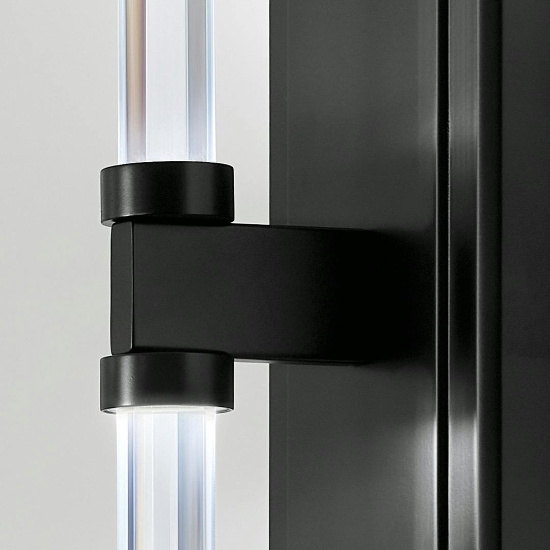 Close up of the Sycara 19 Inch 2 Light LED Wall Sconce with Faceted Crystal in Black on a white background