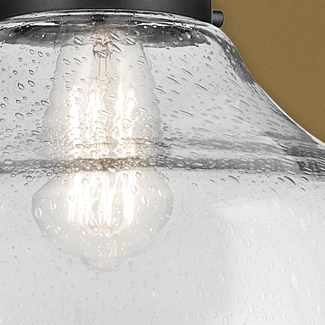 Close up of the Avery 11.25" 1-Light Bell Pendant with Clear Seeded Glass in Black