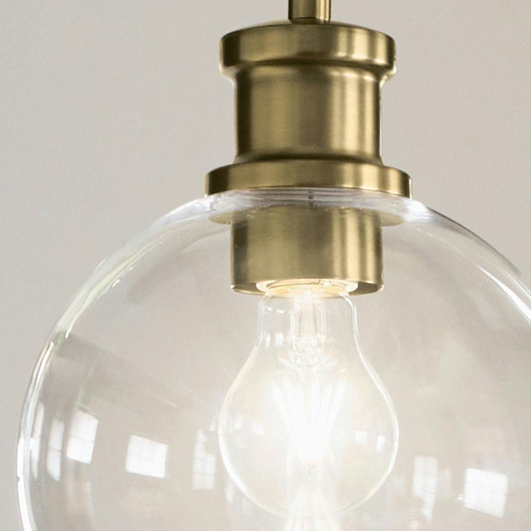 Close up view or the Clove 1 Light Mini Pendant in Black and Brushed Natural Brass