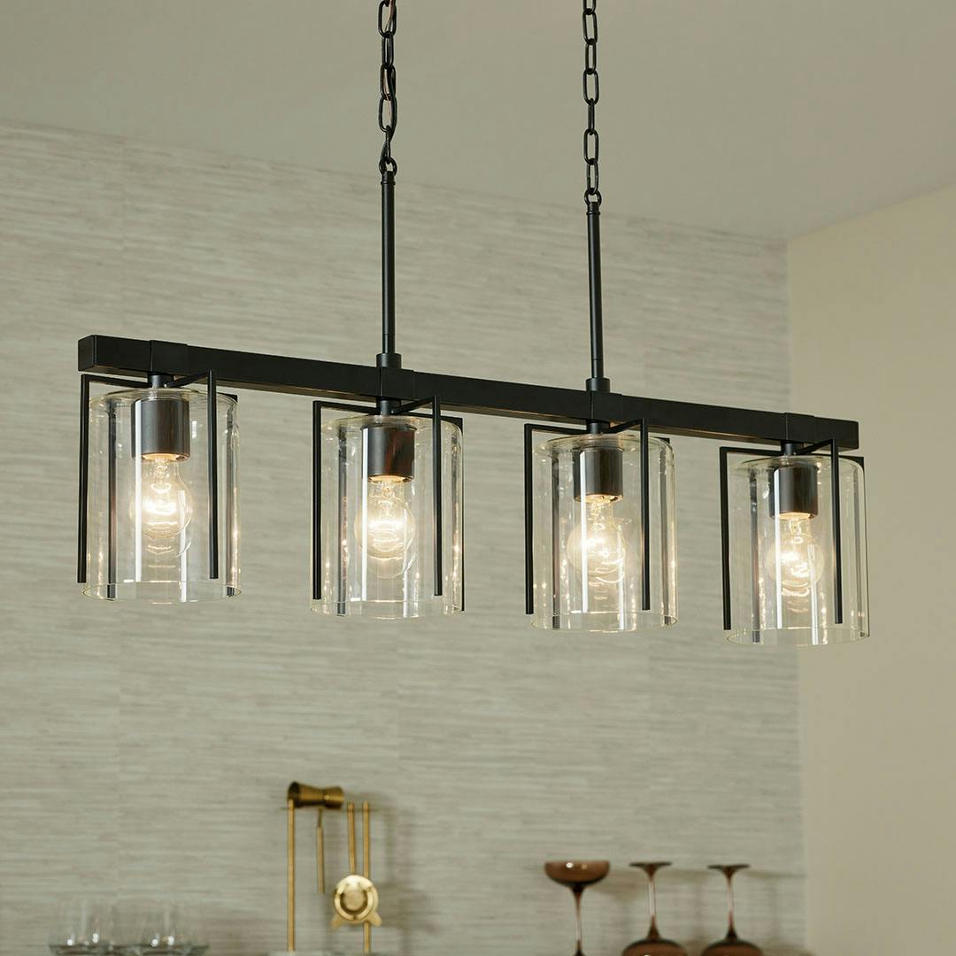 Home bar in day light with the Birk 4 Light Linear Chandelier in Black