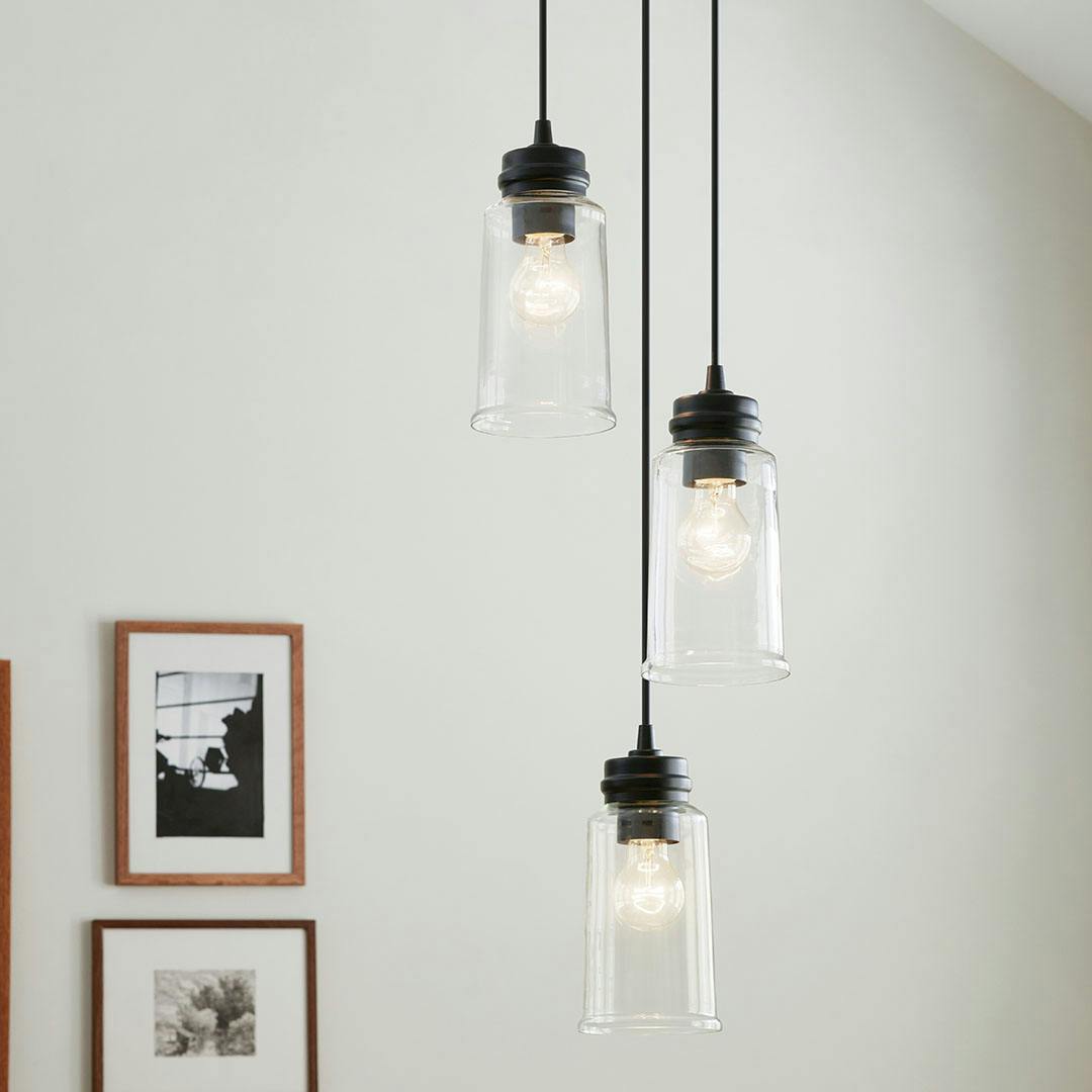 Dining room in day light with the Jaylen 3 Light Cluster Pendant in Black