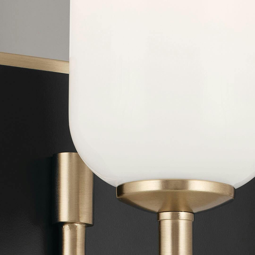 Close up of the Solia 24 Inch 3 Light Vanity with Opal Glass in Champagne Bronze with Black
