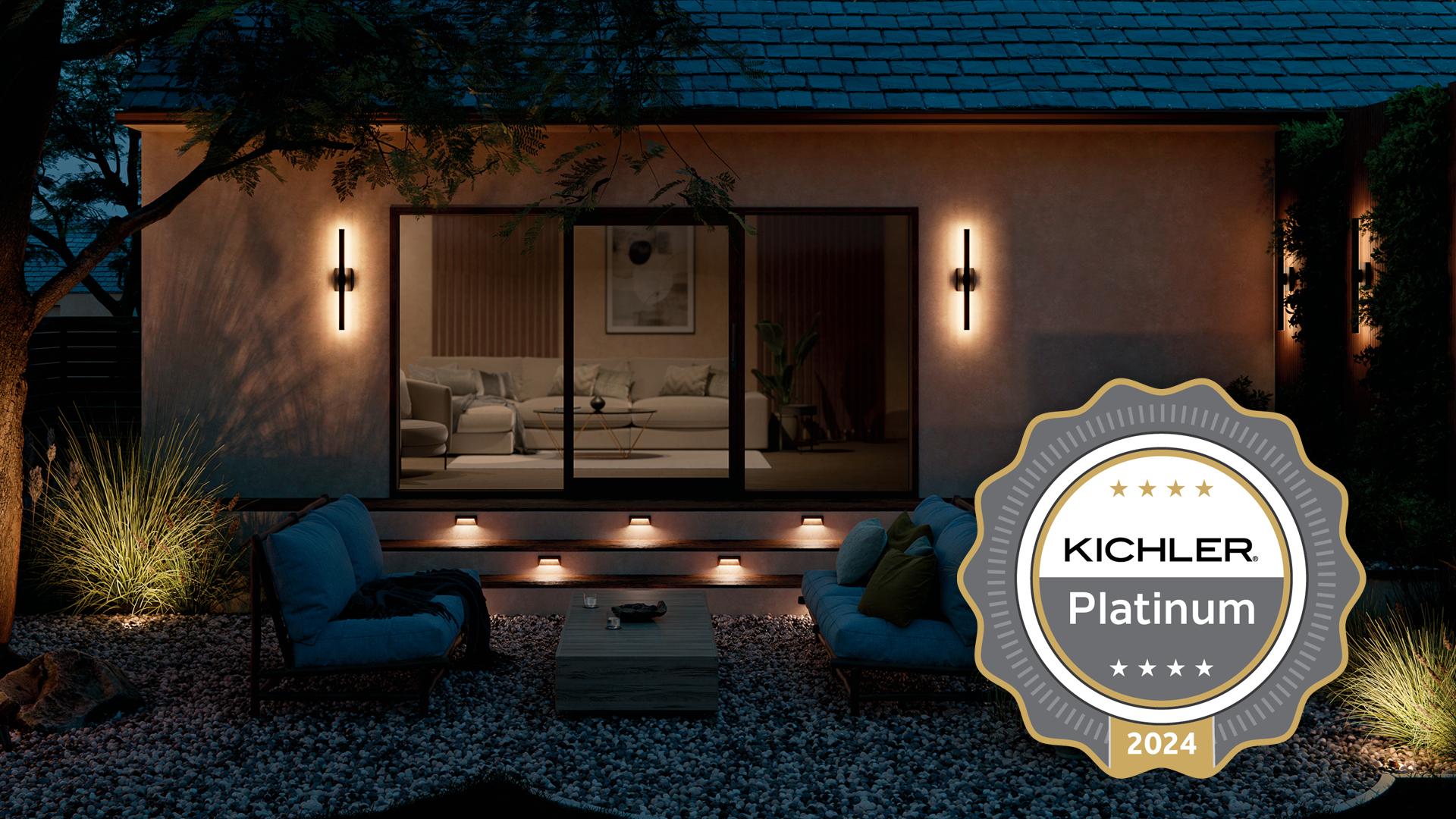 Residential landscape at night with a garden path light and featuring a Kichler Platinum 2024 Medal