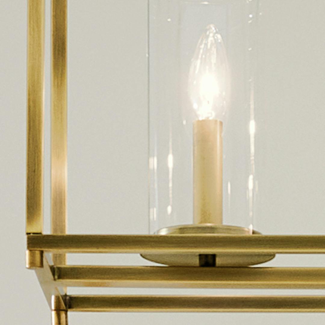 Close up of the Crosby 41.5" 5-Light Linear Chandelier with Clear Glass in Natural Brass