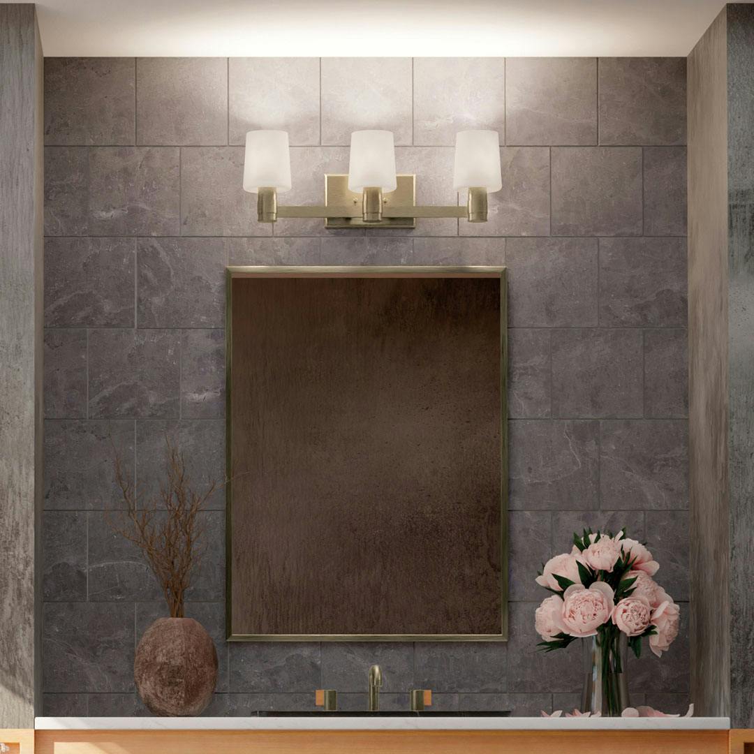 Bathroom in daylight with the Adani 24 Inch 3 Light Vanity Light with Opal Glass in Champagne Bronze