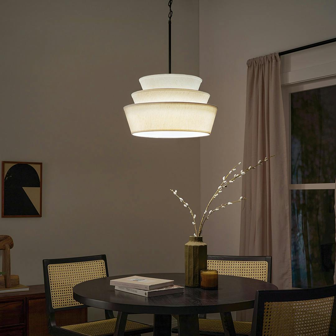 Night time flat featuring the Ebina 4 Light Pendant in Black with Linen Fabric Shades