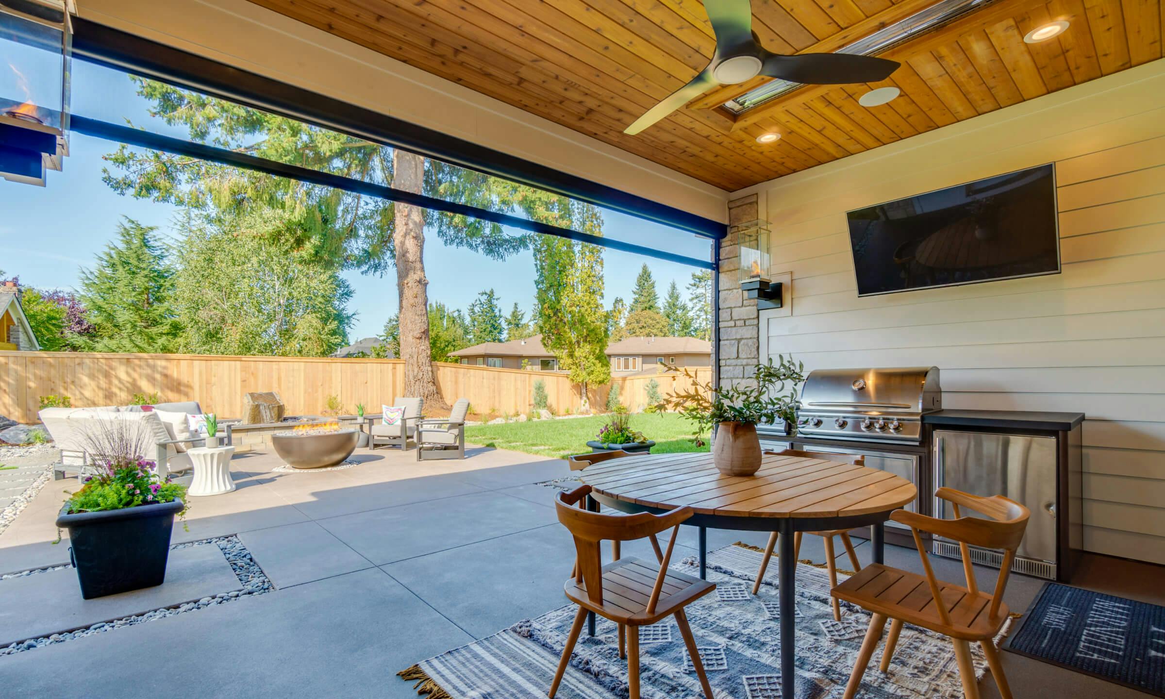An image showing the back patio of a St. Jude home lit with Kichler fixtures 
