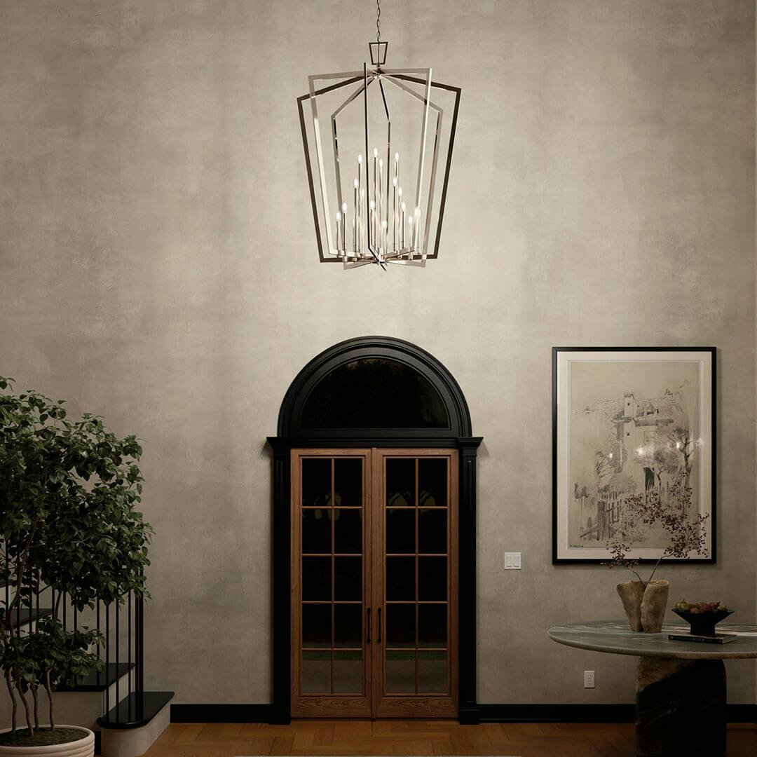 Foyer at night with the Abbotswell 49 Inch 16 Light Foyer Pendant in Polished Nickel