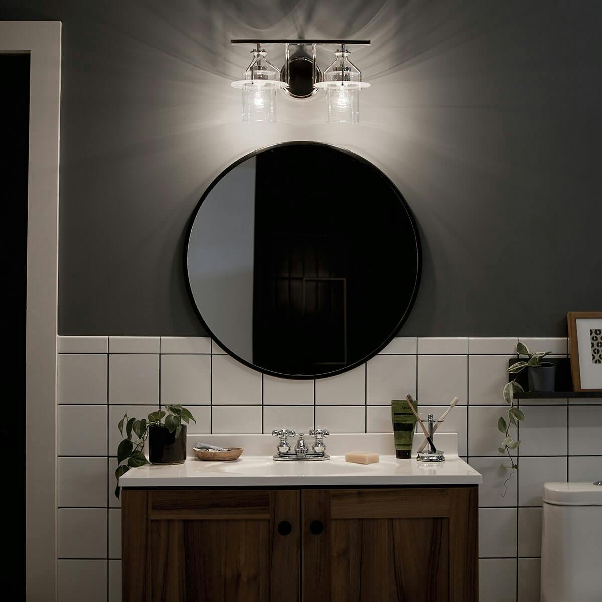 Night time Bathroom image featuring Everett vanity light 55078PN