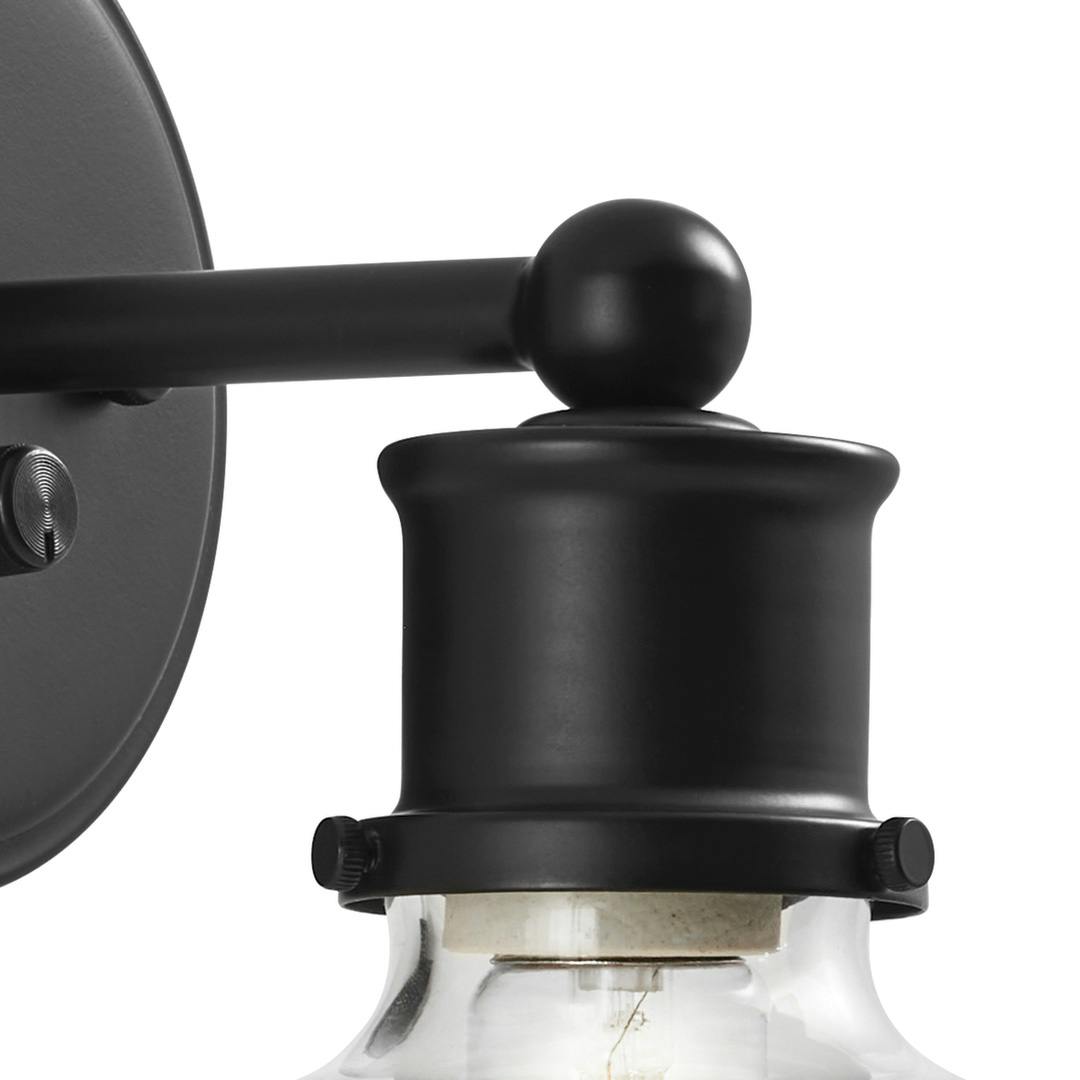 Close up of the Helen 11" Plug-In Wall Sconce Matte Black on the white background