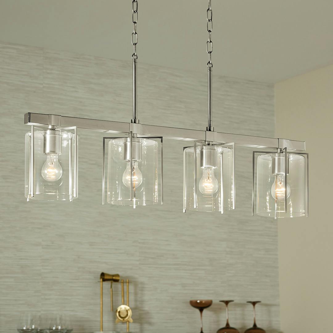 Day time bar featuring the Birk 4 Light Linear Chandelier in Brushed Nickel