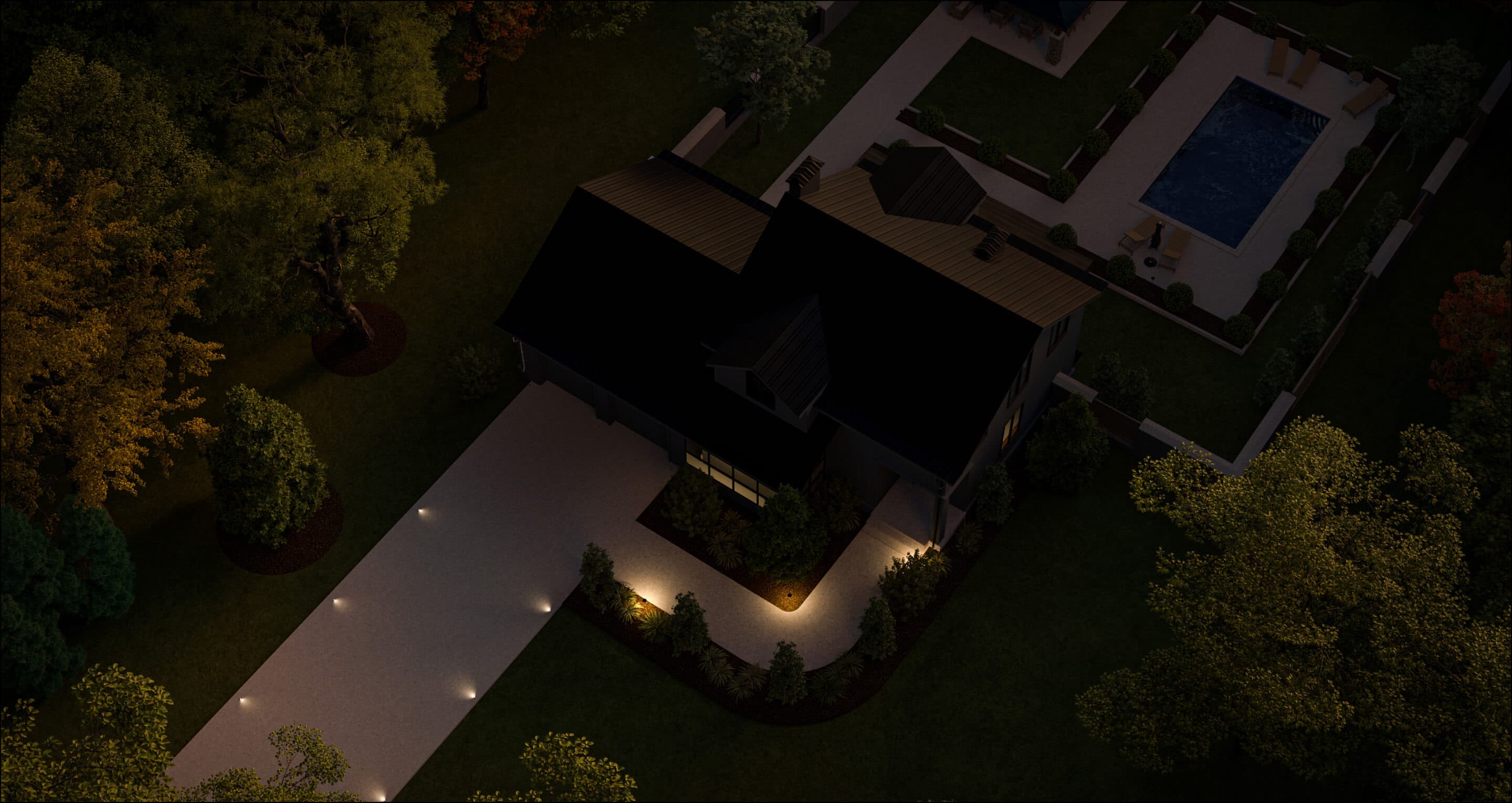 Arial image of a house showing the front and backyard lit with just path lights in the driveway and walk way to the front door 