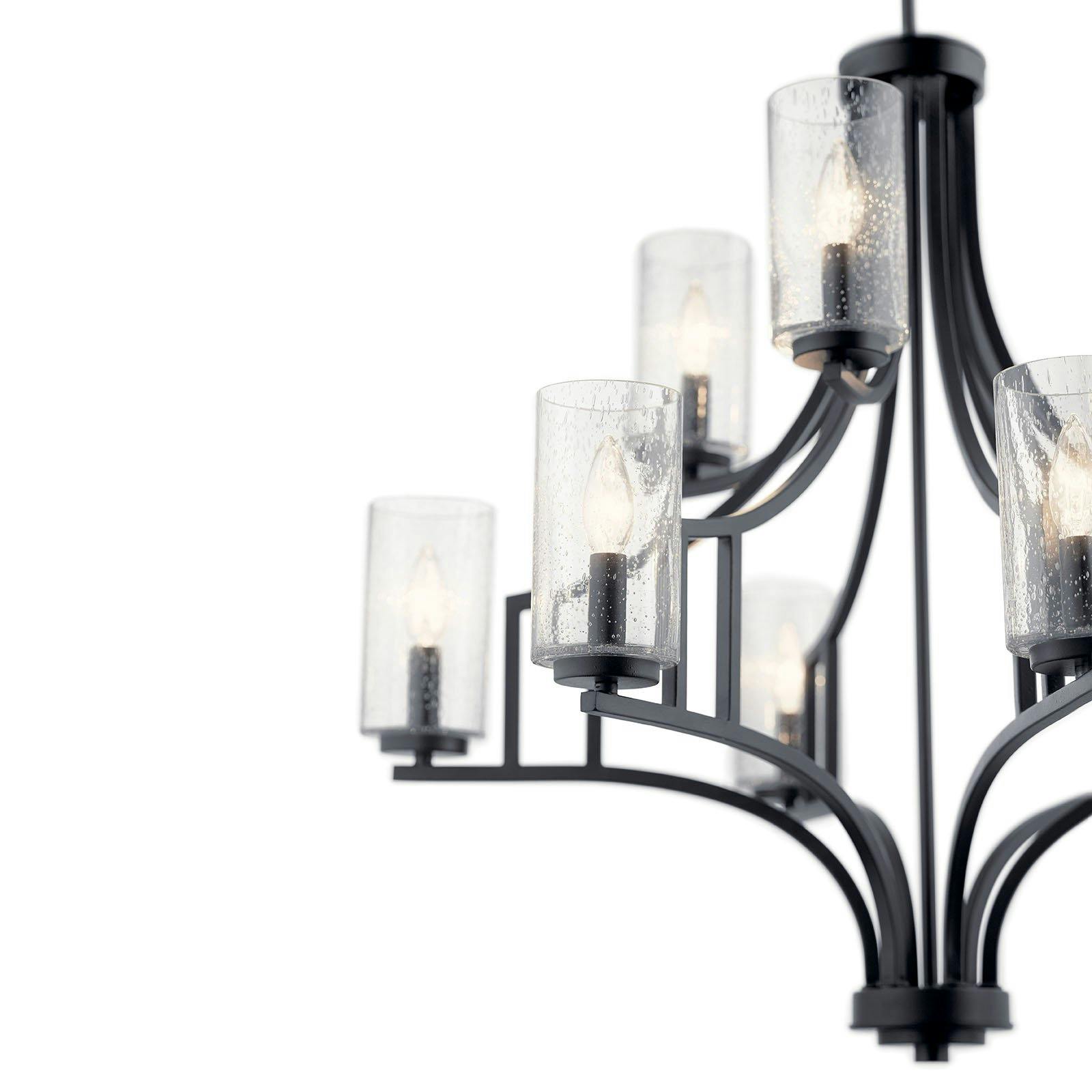Close up view of the Vara 9 Light Chandelier Distressed Black on a white background