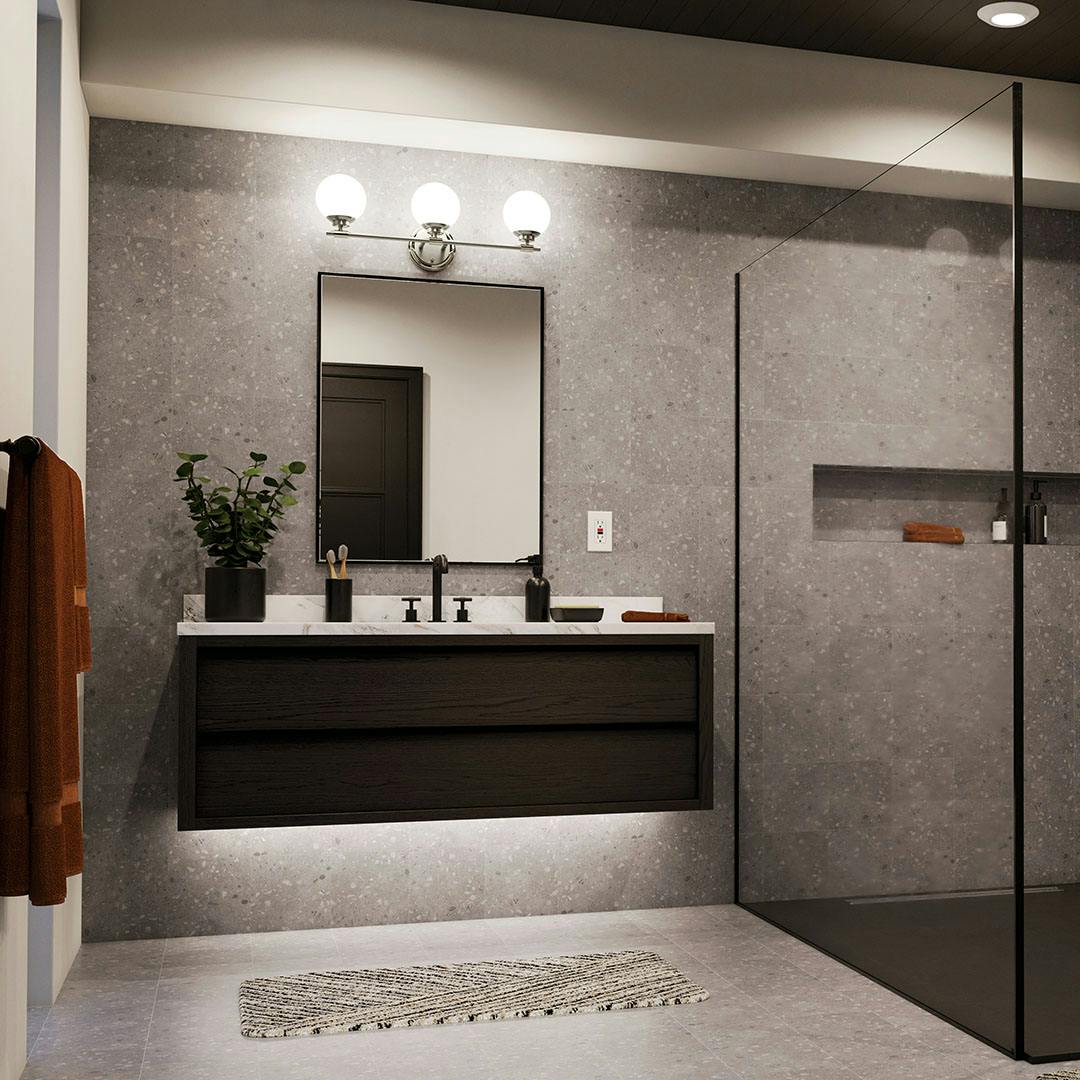 Night time bathroom with the Benno 24.5 Inch 3 Light Vanity Light with Opal Glass in Polished Nickel and Brushed Nickel