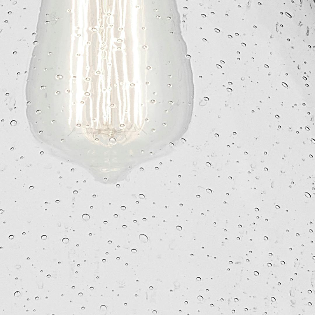 Close up view of the Avery 11.75" 1-Light Cone Pendant with Clear Seeded Glass in Black on a white background