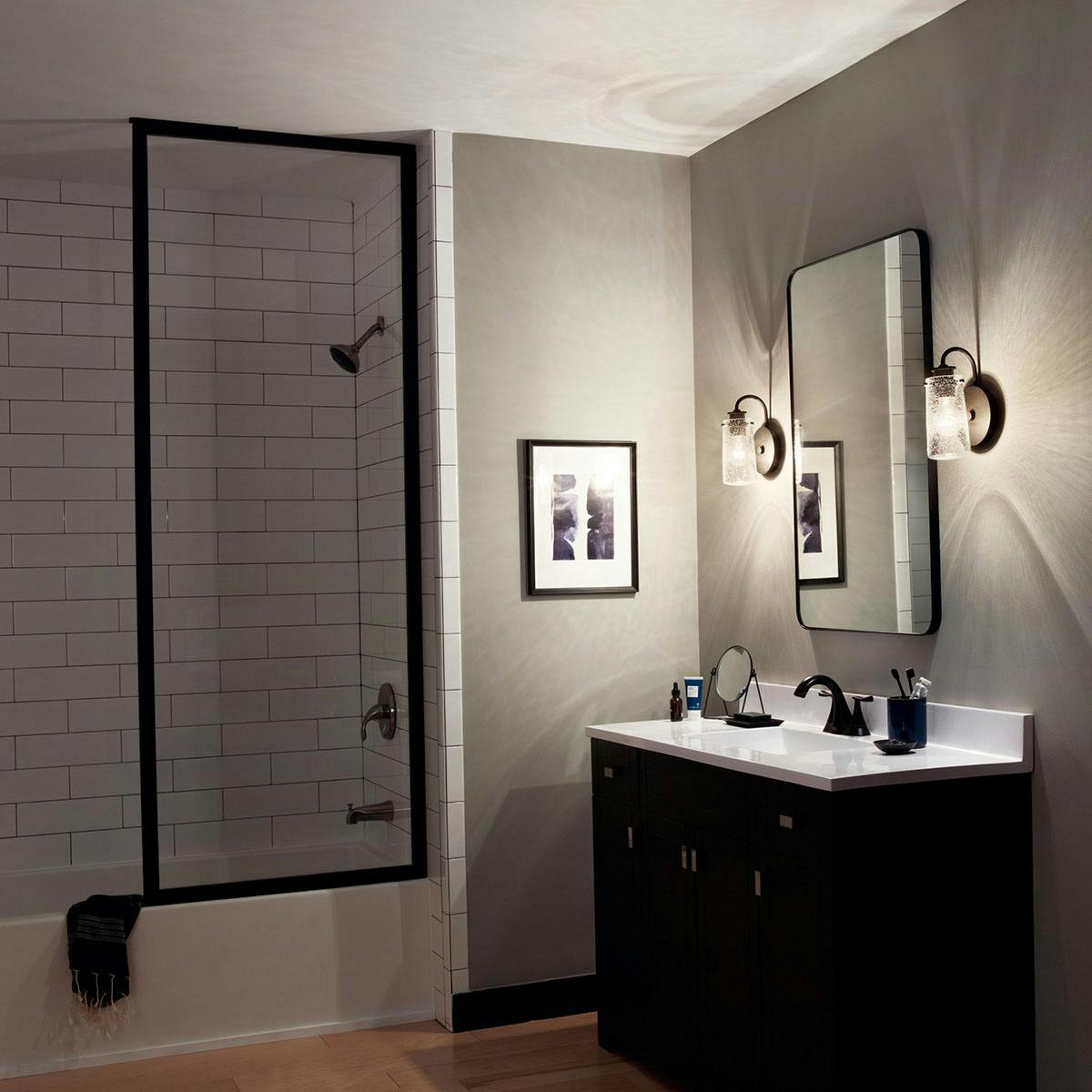 Night time Bathroom featuring Braelyn vanity light 45457OZ