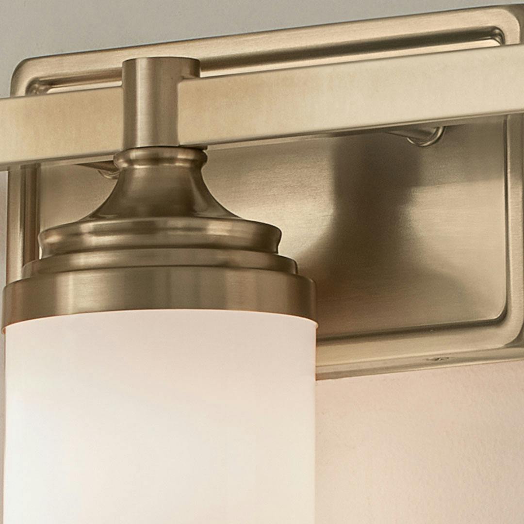 Close up view or the Noha 24 In. 3-Light Champagne Bronze Vanity Light with Opal Glass Shades