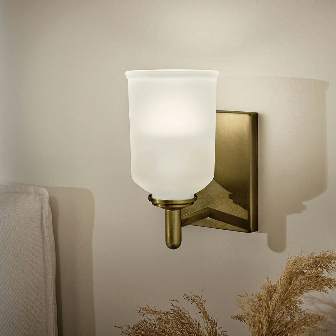 Bedroom in day light with the Shailene 5" 1-Light Wall Sconce in Natural Brass