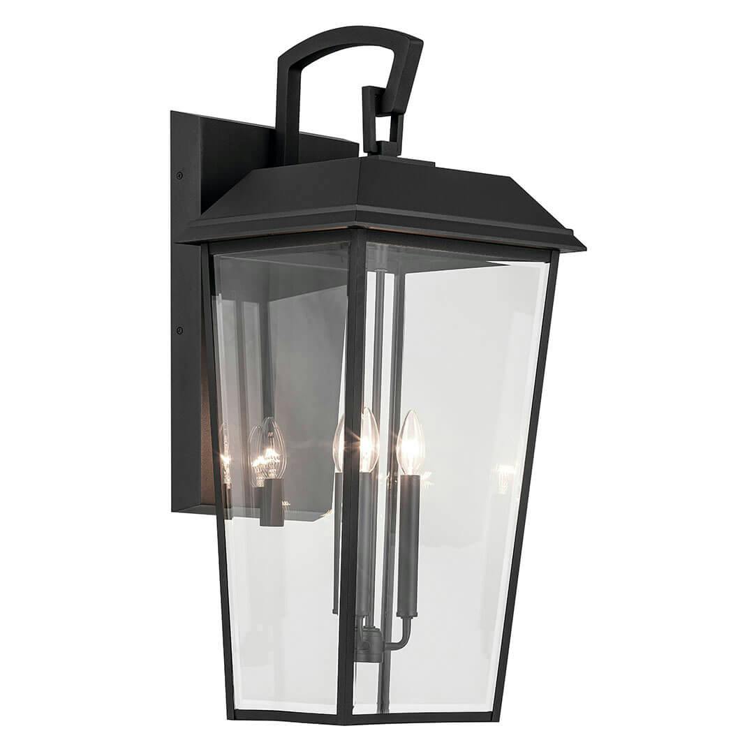 The Mathus 30.25" 3 Light Outdoor Wall Light with Clear Glass in Textured Black on a white background