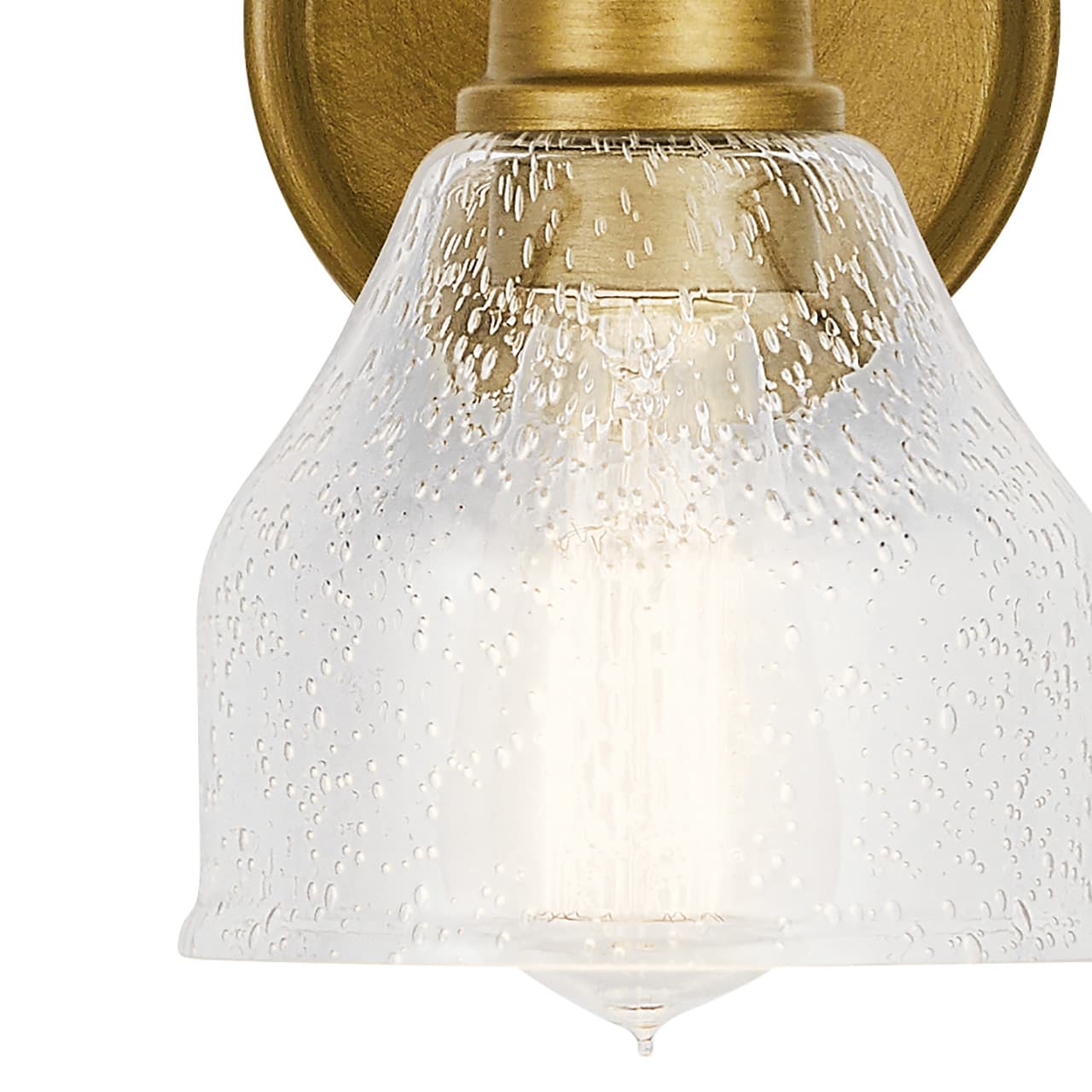 Close up view of the Avery 1 Light Wall Sconce Natural Brass on a white background