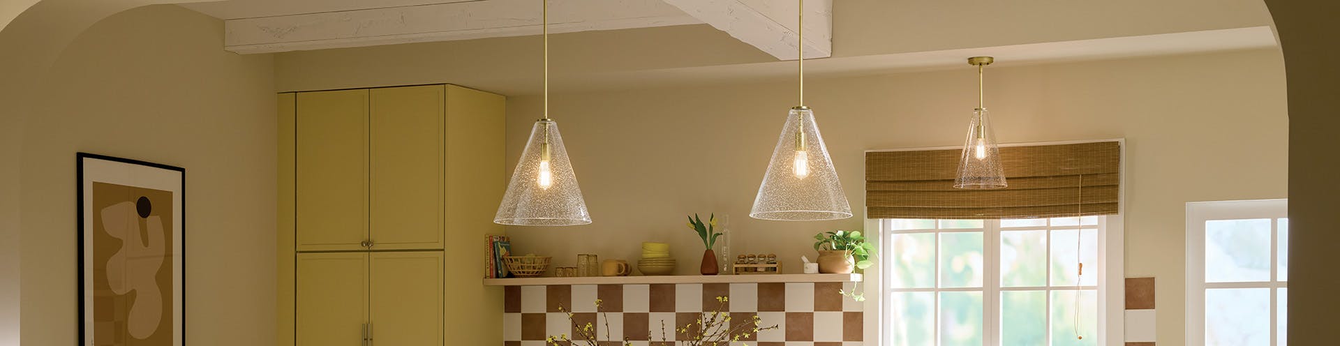 Everly pendants hanging over a kitchen island during the day.