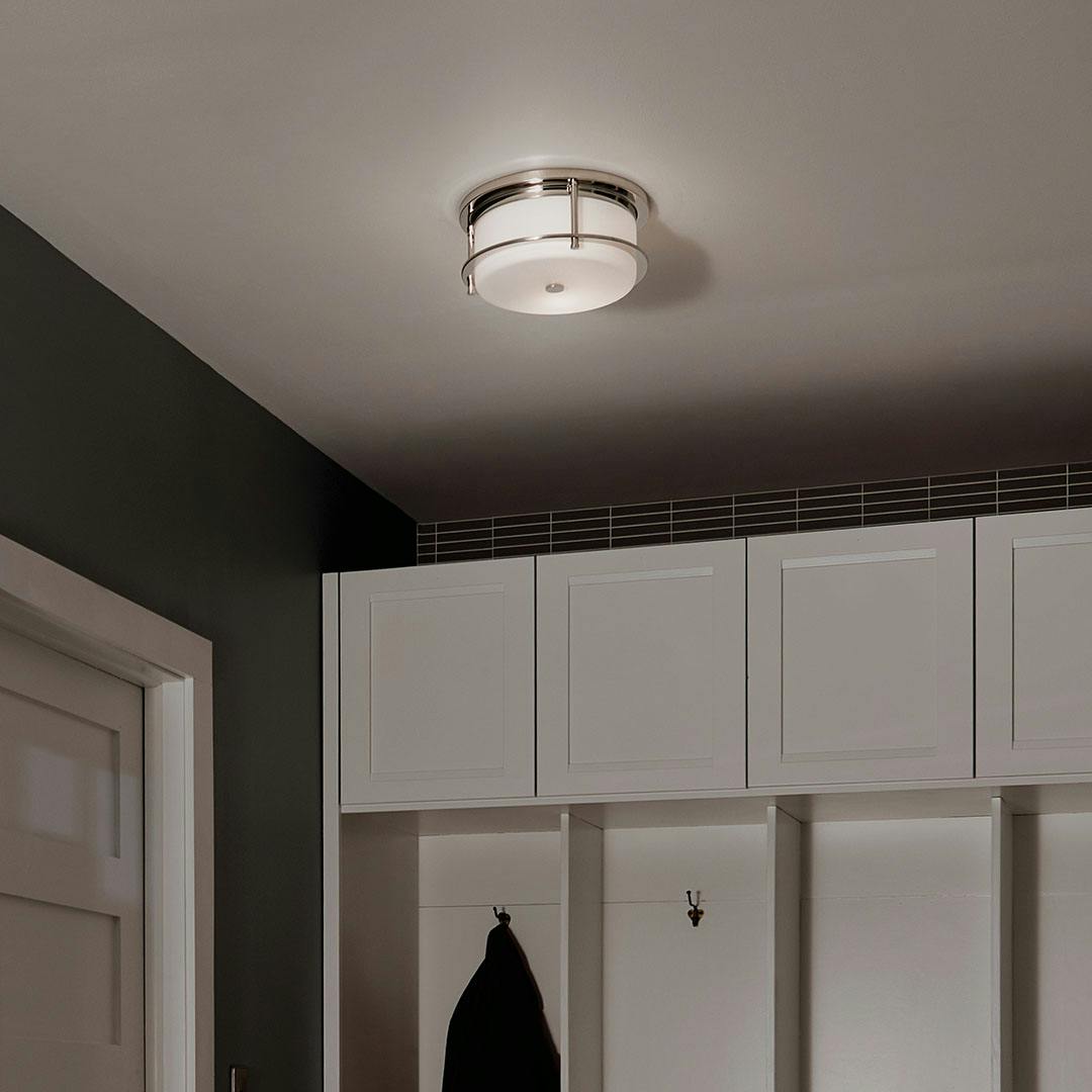 Night time mudroom with Brit 12 Inch 2 Light Flush Mount with Satin Etched Cased Opal Glass in Polished Nickel