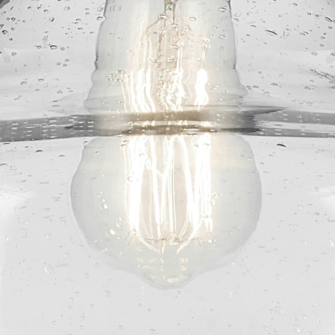 Close up view of the Avery 11.25" 1-Light Bell Pendant with Clear Seeded Glass in Nickel on a white background