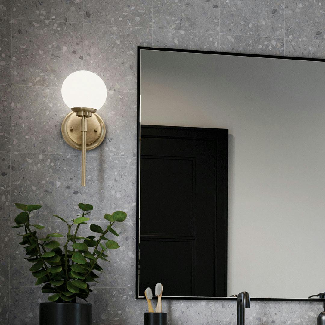 Day time bathroom with the Benn 13.75 Inch 1 Light Wall Sconce with Opal Glass in Champagne Bronze