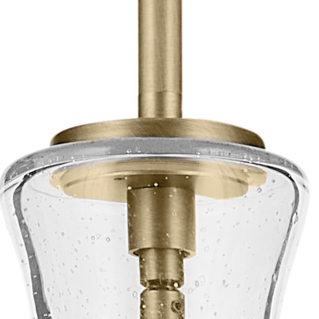 Close up view of the Everly 17.75" 1-Light Bell Pendant with Clear Seeded Glass in Brushed Natural Brass on a white background