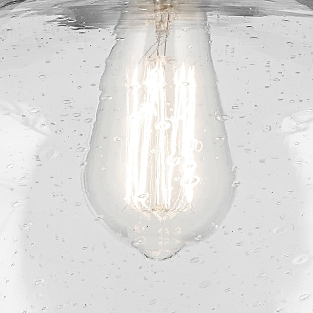 Close up view of the Avery 14" 1-Light Globe Pendant with Clear Seeded Glass in Nickel on a white background