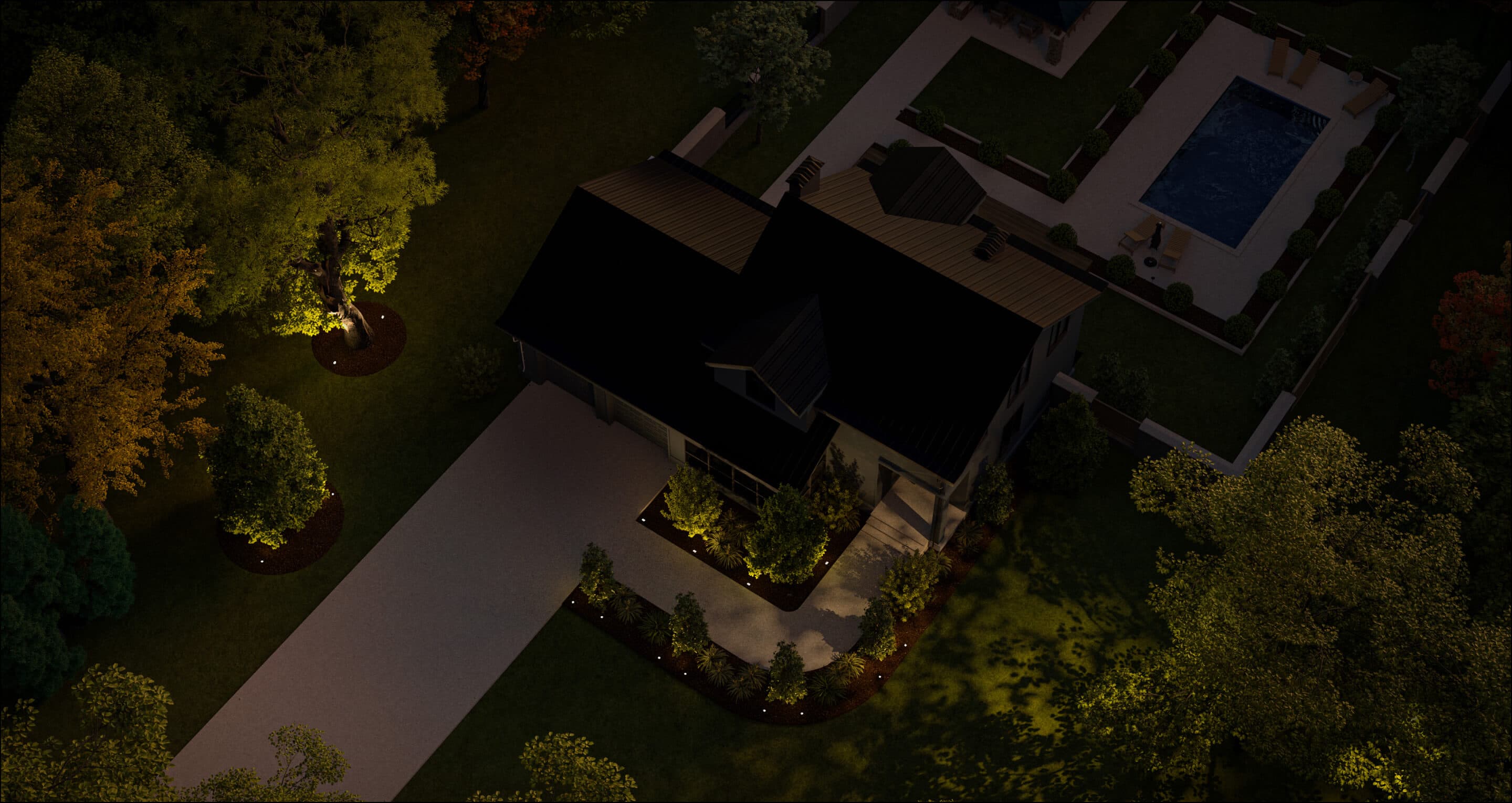 Arial image of a house showing the front and backyard with just the tree lights in the front yard turned on at night 