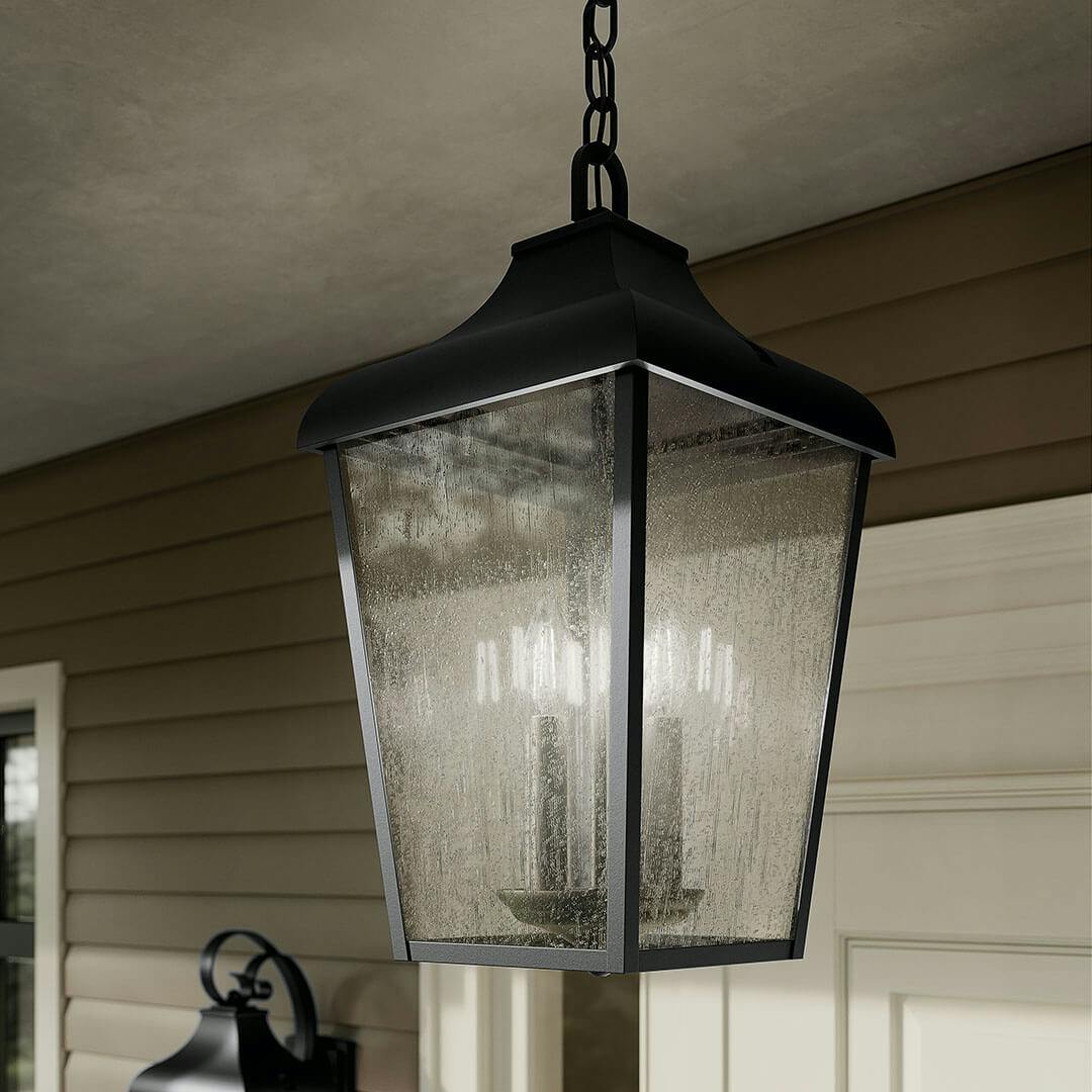 Day time porch with the Forestdale 4-Light Outdoor Pendant in Textured Black