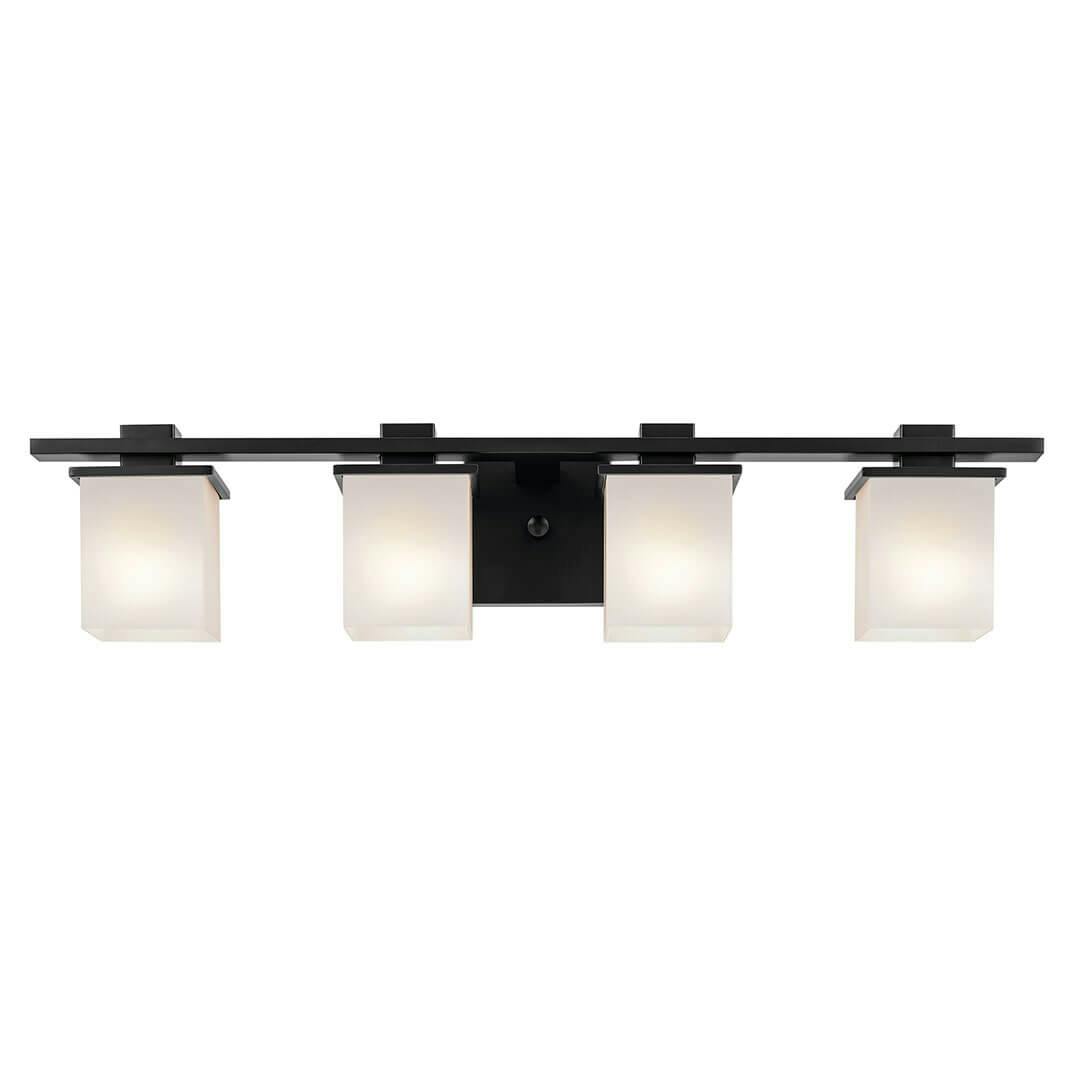 The Tully 32" 4-Light Vanity Light in Black mounted down on a white background
