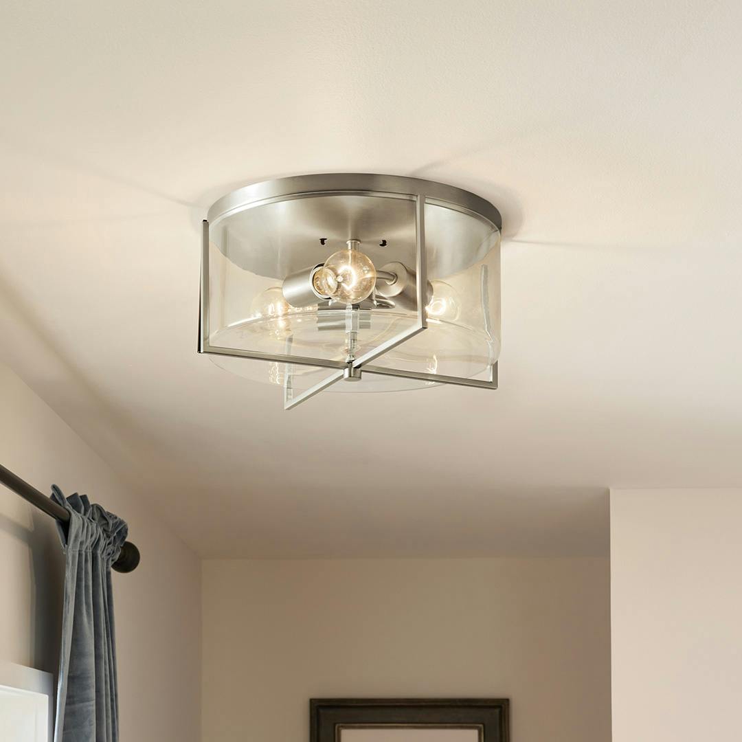 Day time hallway featuring the Birk 3 Light Flush Mount Light in Brushed Nickel