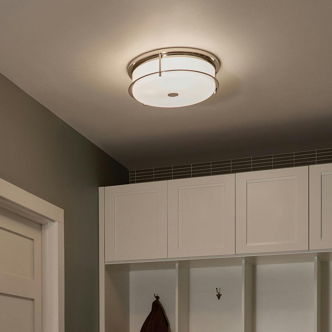 Night time mudroom with Brit 18 Inch 4 Light Flush Mount with Satin Etched Cased Opal Glass in Polished Nickel
