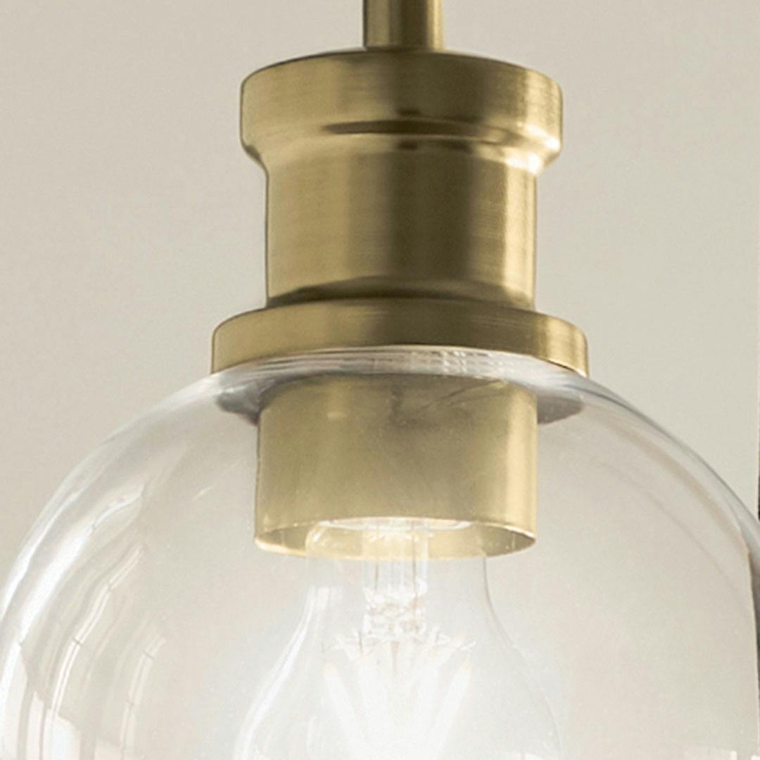 Close up view or the Clove 3 Light Cluster Pendant in Black and Brushed Natural Brass