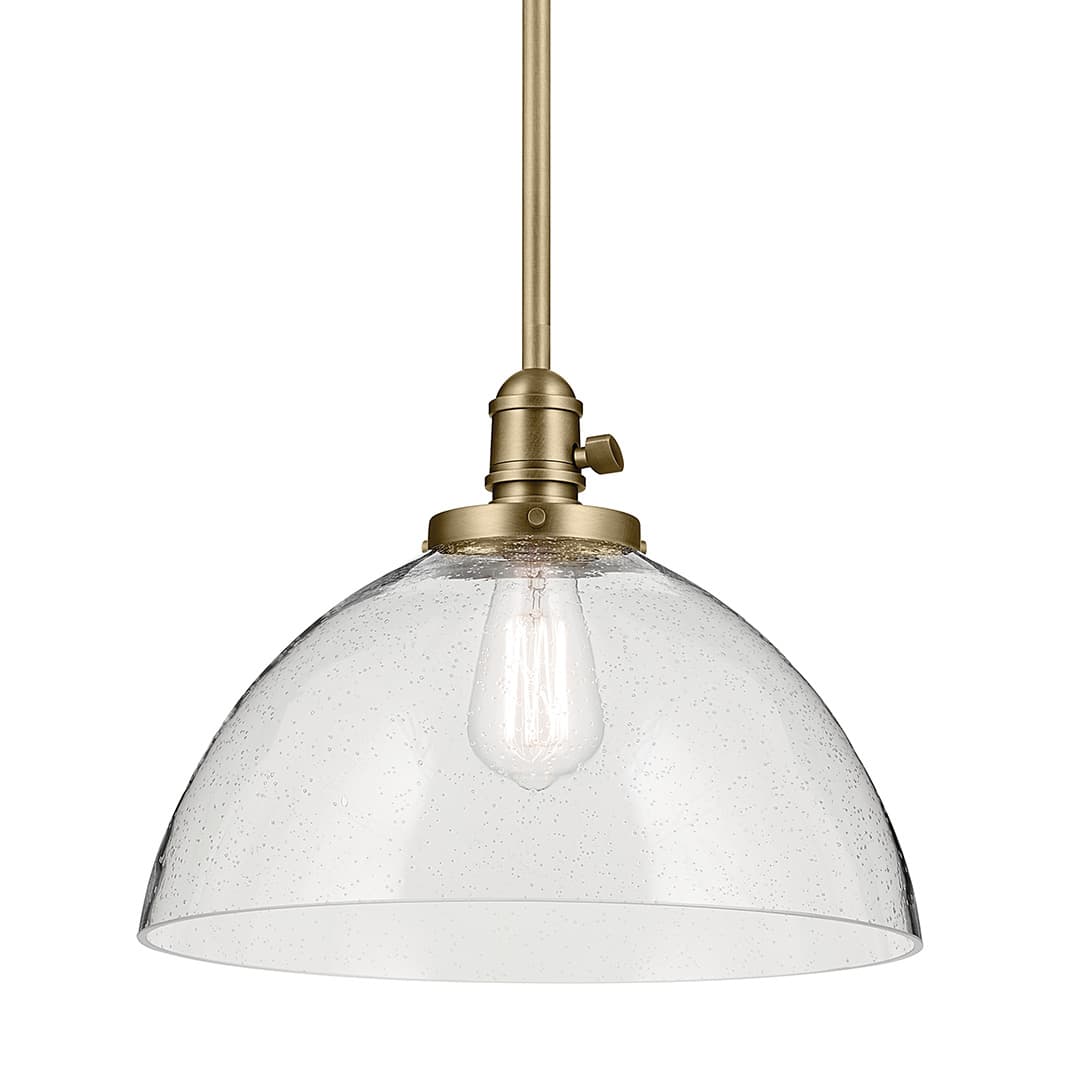 The Avery 11" 1-Light Dome Pendant with Clear Seeded Glass in Natural Brass on a white background