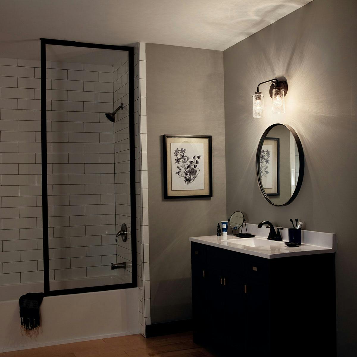 Night time Bathroom featuring Braelyn vanity light 45458OZ