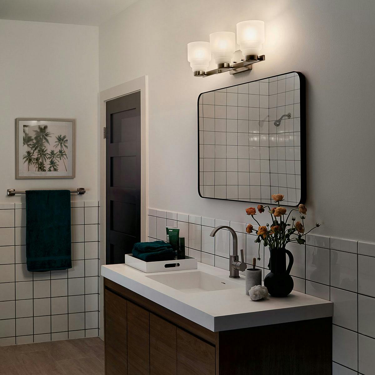 Nighttime Bathroom featuring Vionnet vanity light 55012NI