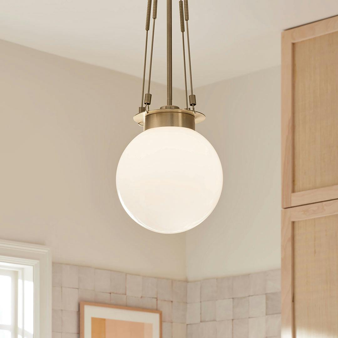 Day time kitchen with the Albers 10.5 Inch 1 Light Pendant with Opal Glass in Champagne Bronze