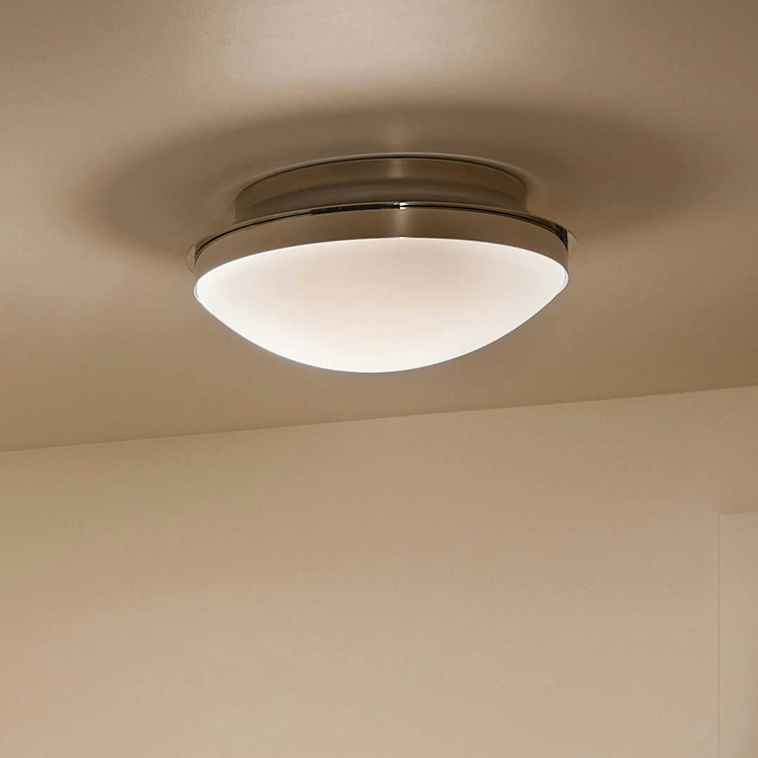 Night time entryway with Bretta 17.75" 3 Light Flush Mount Polished Nickel 