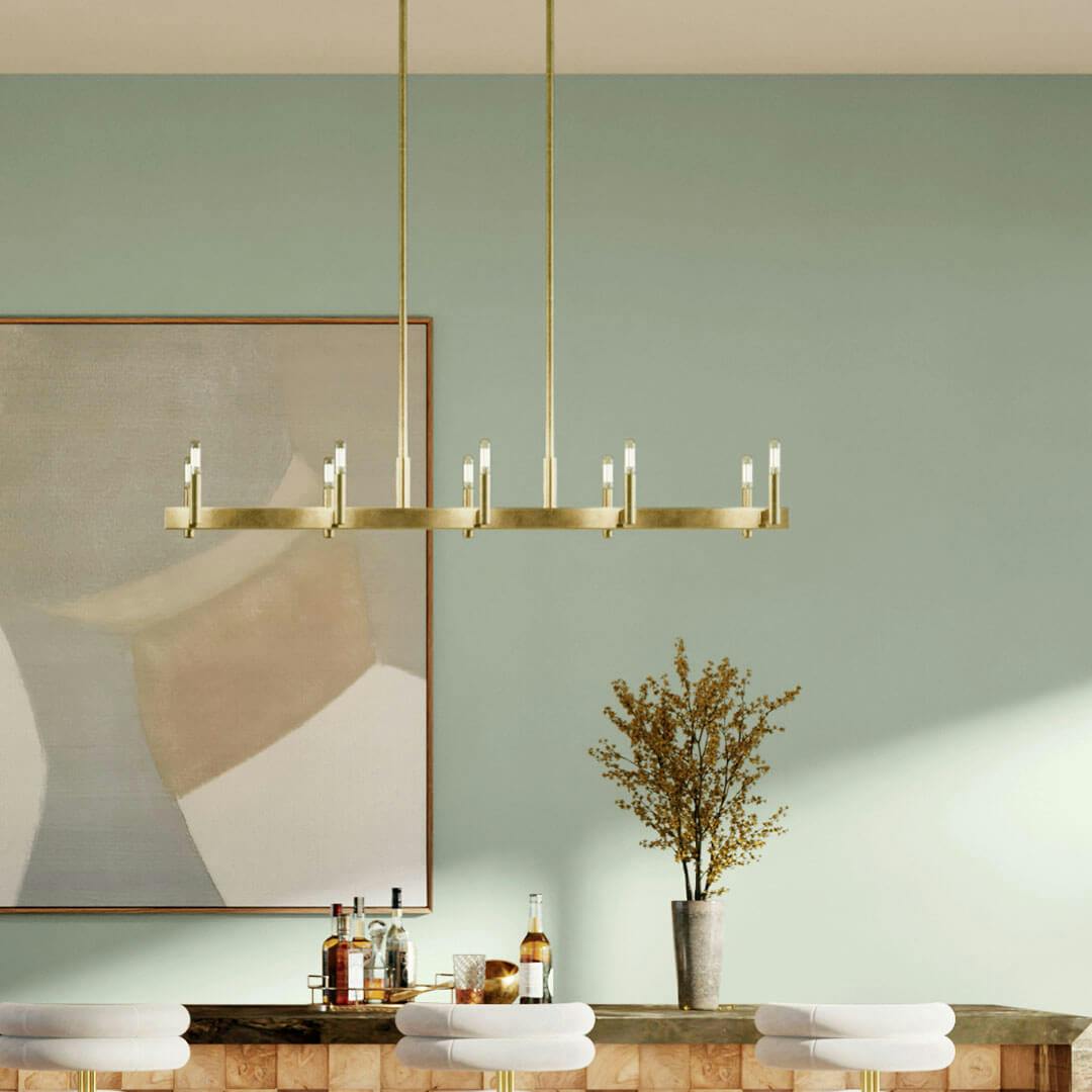 Bar in day light with the Erzo 50" 10 Light Linear Chandelier in Natural Brass
