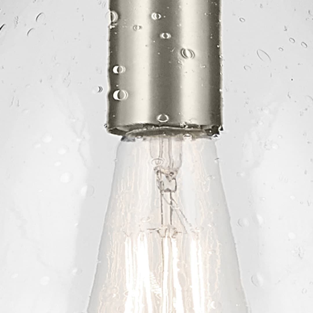 Close up view of the Everly 17.75" 1-Light Bell Pendant with Clear Seeded Glass in Brushed Nickel on a white background