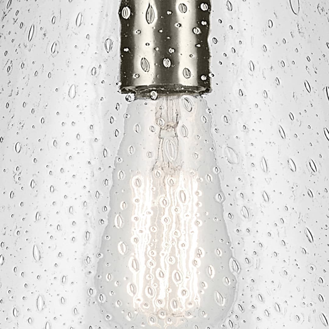 Close up view of the Everly 15.5" 1-Light Cone Pendant with Clear Seeded Glass in Brushed Nickel on a white background