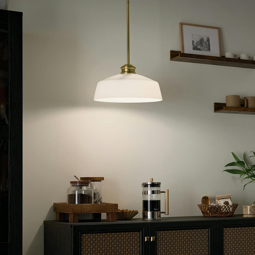Night time flat featuring the Renneker 1 Light Pendant in Brushed Natural Brass